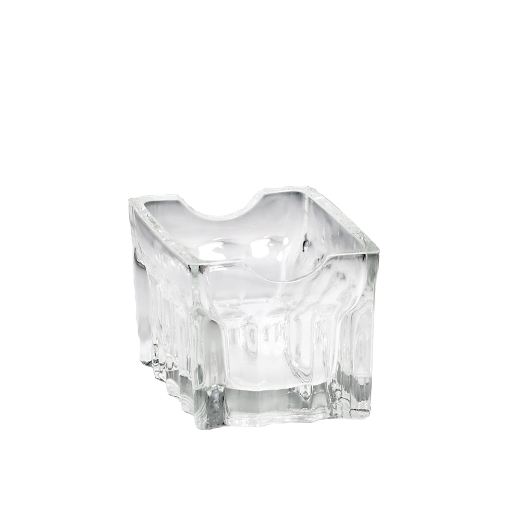 A clear, thick fluted glass ashtray with an irregular, sculpted surface and a square base. The upper rim features a curved notch for resting a cigarette. This dishwasher safe ashtray is empty and photographed against a plain white background.