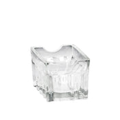A clear, thick fluted glass ashtray with an irregular, sculpted surface and a square base. The upper rim features a curved notch for resting a cigarette. This dishwasher safe ashtray is empty and photographed against a plain white background.