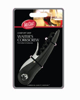 A black waiter’s corkscrew by TableCraft is displayed in its packaging, which highlights the comfort grip handle and built-in foil cutter. The packaging features the brand name, product details, and a photo of two wine glasses.