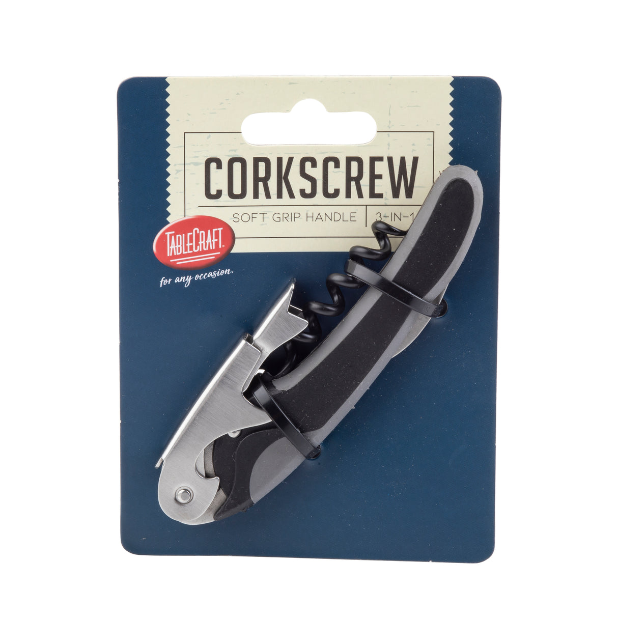A black and silver waiter’s corkscrew in packaging labeled Corkscrew 3-in-1 features a soft grip handle. This curved, double hinged corkscrew also includes a bottle opener and foil cutter. The dark blue packaging displays the red and white TableCraft logo.