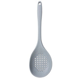 A gray perforated silicone spoon with a long handle and round, shallow bowl. The heat resistant spoon features multiple small holes for draining liquids and is BPA free. The handle includes a hole at the end for convenient hanging.