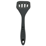 A black Cash & Carry Turner with a solid handle featuring three kitchen-related symbols and a small hole for hanging. The silicone head is heat resistant, has four slots for draining liquids, and the utensil is ideal for everyday kitchen use.