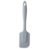 A gray silicone spatula with a rectangular, slightly curved blade and a long handle. This heat resistant spatula features a hanging hole and solid color, photographed clean and simple on a white background.