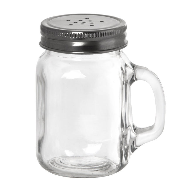 A clear glass jar, resembling a Mason salt shaker, sits upright on a plain white background. It features a sturdy handle on the right and a metal lid with multiple small holes, perfect for use as a pepper shaker.