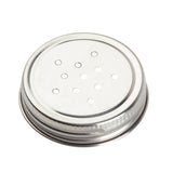 A round, silver metal shaker lid with multiple small holes arranged in a circular pattern and a threaded edge for screwing onto a Mason salt shaker or glass jar. The shiny, reflective surface adds style to any container.