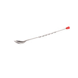 A stainless steel bar spoon with a twisted handle and a small red cap at the end rests on a white background. Its slightly oval-shaped bowl and dishwasher safe design make it perfect for mixing drinks.