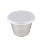 A small, silver TableCraft ramekin with straight sides and a slightly wider top, covered by a white, opaque plastic lid. The 2-1/2 oz ramekin is set against a plain white background.