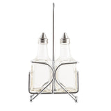 The TableCraft Oil & Vinegar Dispenser Set features two clear glass bottles with metal screw caps in a silver wire holder with a tall handle. Perfect for condiments, this Cash & Carry essential is ideal for stylish tabletop service.