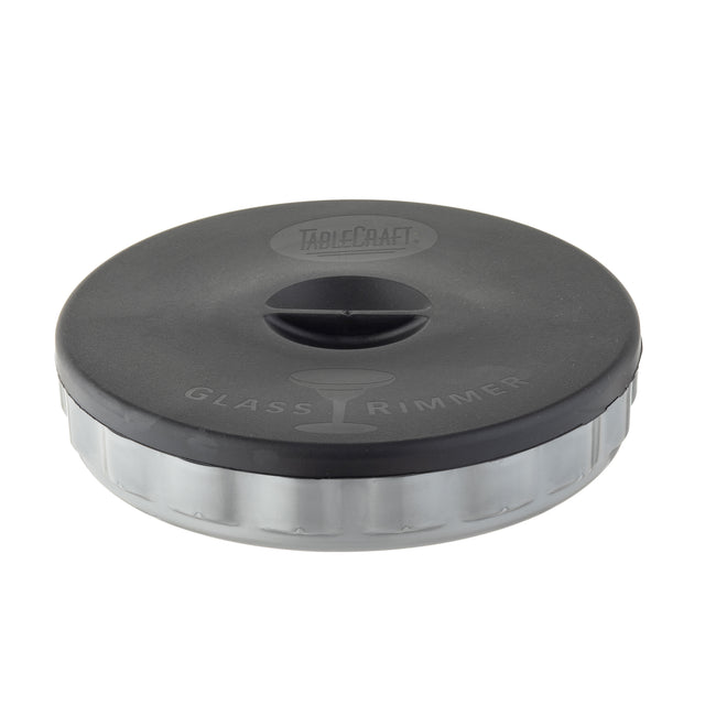 A round, black and clear polypropylene container labeled TableCraft Glass Rimmer with an illustration of a cocktail glass; designed for coating glass rims with salt or sugar. The lid has a small, raised handle in the center and is dishwasher safe.