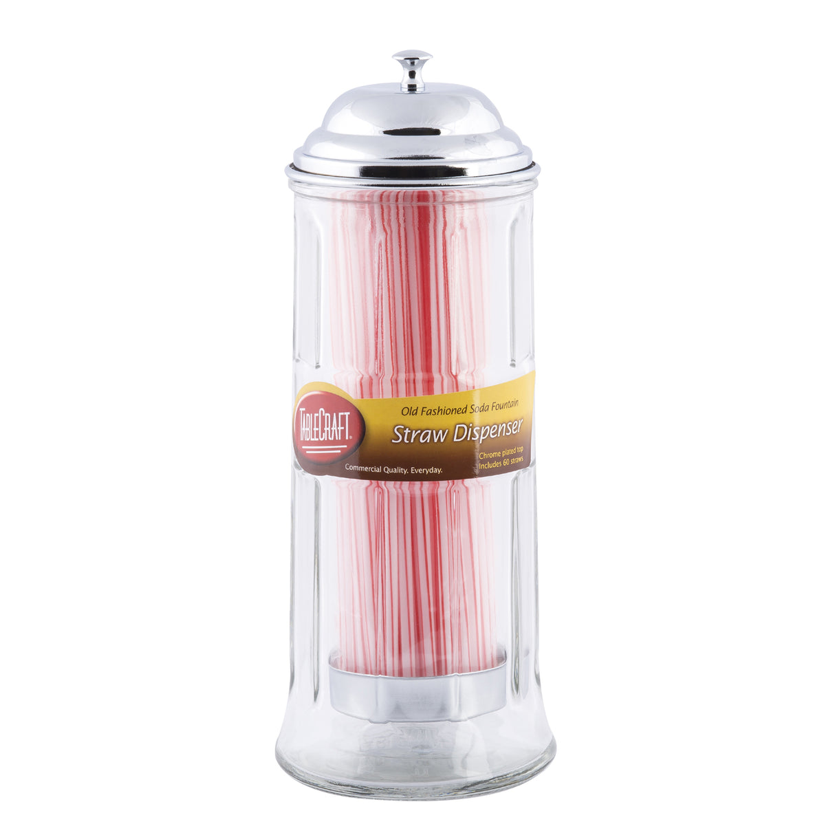 A clear TableCraft glass straw dispenser with a shiny silver lid is filled with pink and white striped straws. A yellow and brown label on the front reads Old Fashioned Soda Fountain Straw Dispenser, standing out against the white background.