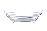 A chrome plated silver metal wire serving basket with a circular base and sloping sides formed by concentric rings, creating an open, airy structure. The basket has two upward-angled handles integrated into the design. Background is plain white.