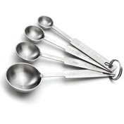 This stainless steel measuring spoon set includes four shiny spoons labeled with standard measurements. Stacked on a metal ring, each is dishwasher safe for easy cleanup and lasting durability.