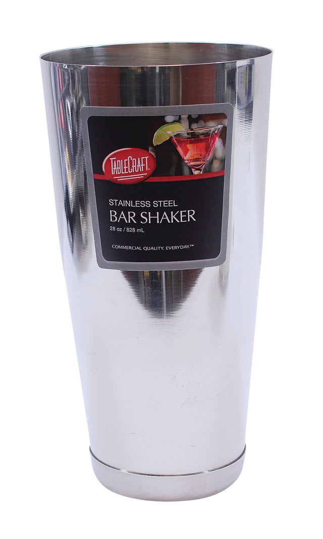 A shiny Bar Shaker crafted from stainless steel, featuring a black and red label that reads TableCraft Stainless Steel Bar Shaker, 28 oz / 828 mL. A cocktail with a lime garnish appears on the label as the upright shaker displays its commercial quality.