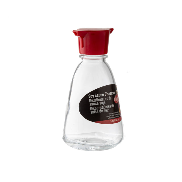 A clear TableCraft glass soy sauce dispenser with a red plastic cap and a black label displaying "Soy Sauce Dispenser" in English, French, and Spanish, plus the 5 oz / 148 ml capacity. The dispenser is empty.