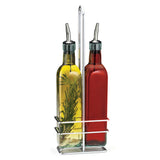 Two glass bottles with stainless steel pourers are held in a chrome plated rack. One contains yellow oil with rosemary, the other red vinegar. The stylish caddy features a tall central handle for easy carrying—an elegant glass bottle set for your table.