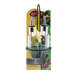 Two green tint glass bottles with stainless steel pourers sit in a black metal rack. The packaging label reads “Gemelli Set” and “Oil & Vinegar Dispenser Set,” featuring a salad image in the background—perfect for dispensing oil and vinegar.