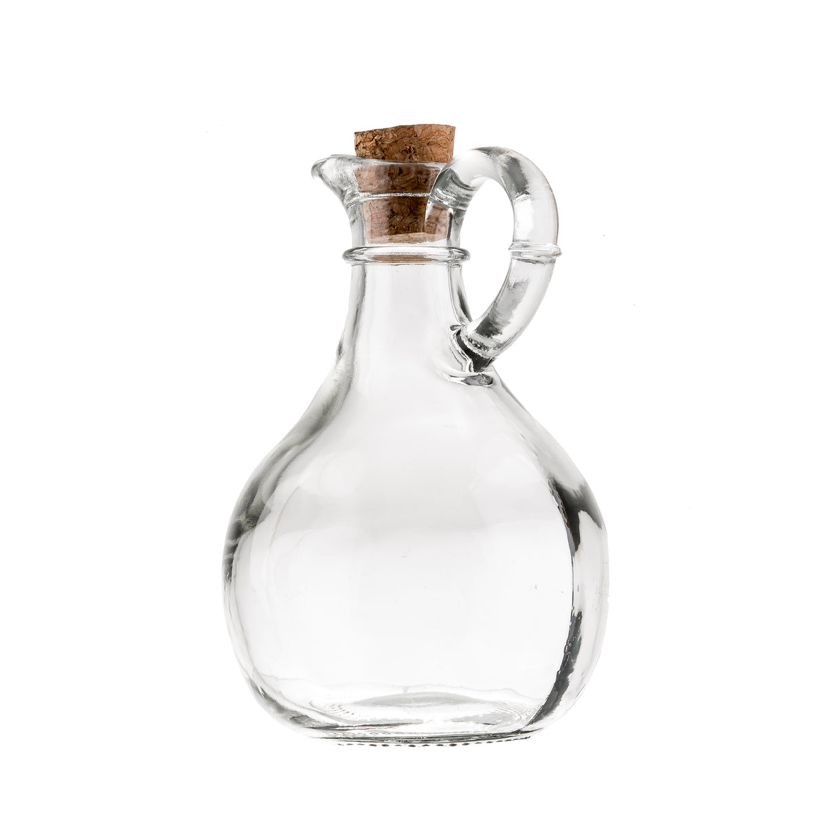 A clear glass bottle by TableCraft Products with a round body, narrow neck, and curved handle, sealed with a brown cork stopper. This elegant Olive Oil Bottle is empty and set against a white background.
