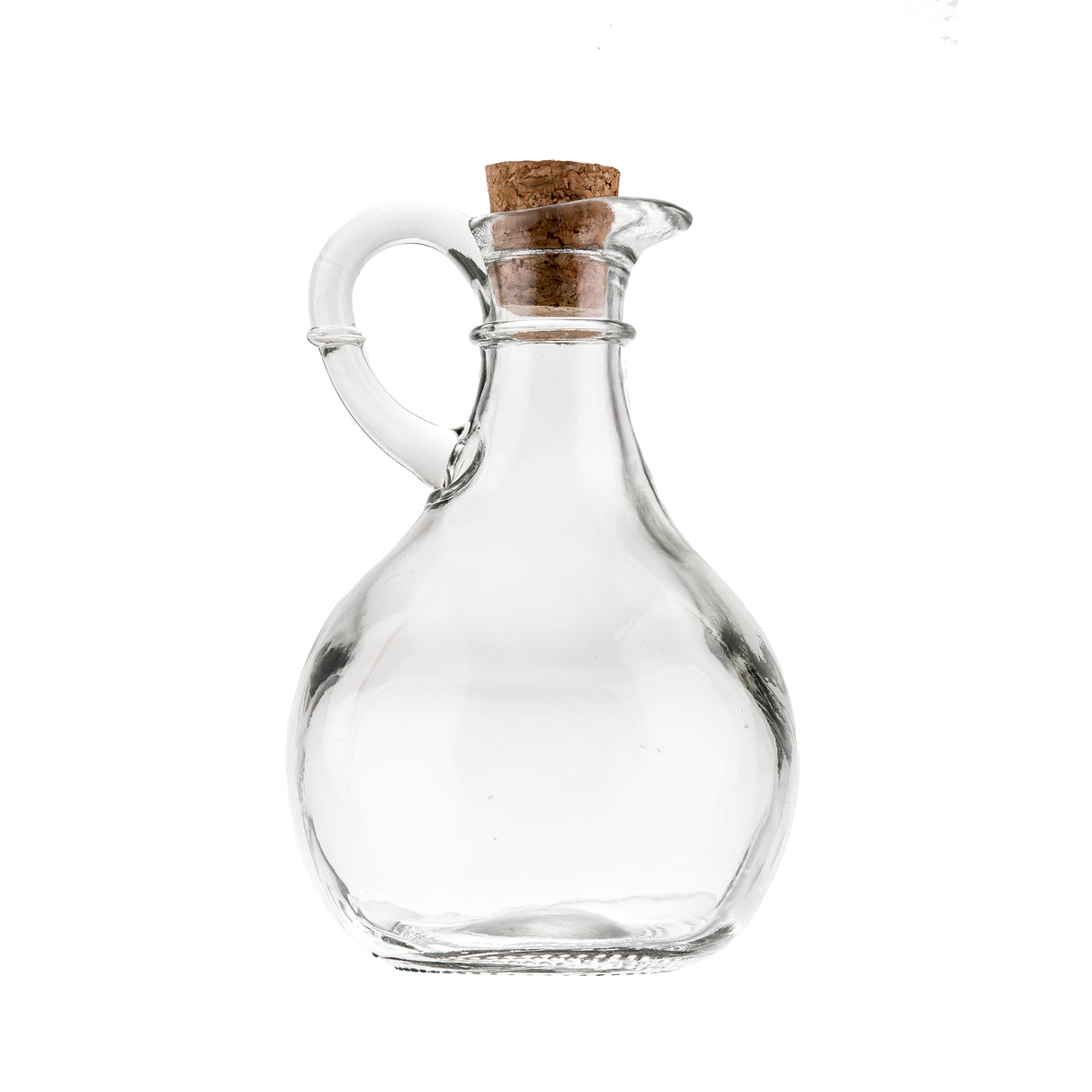 A clear glass bottle cruet with a rounded body, small spout, curved handle, and cork stopper. This Olive Oil Bottle by TableCraft Products is photographed against a plain white background.