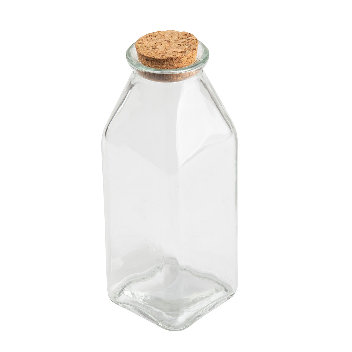A clear, empty Glass Milk Jar with a square base and gently sloping shoulders, sealed with a round, light-brown cork stopper. Shown against a plain white background, the jar highlights its transparency and simple design.