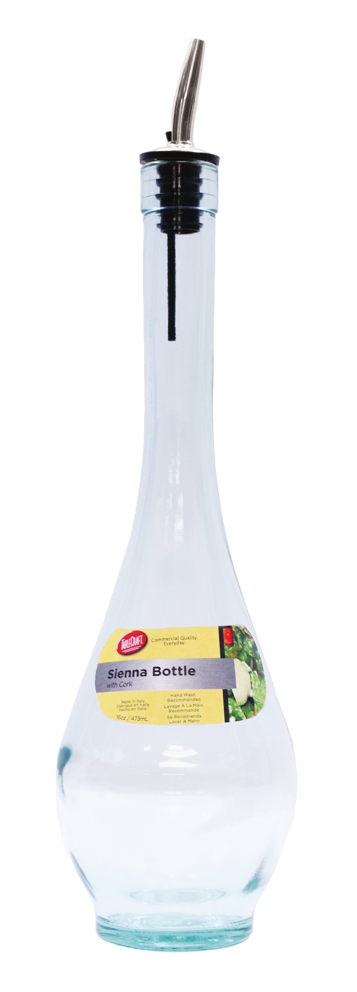 A clear green tint glass olive oil bottle with a long neck, stainless steel pourer, and black top. It features a yellow “Sienna Bottle” label with branding and an image of olives. The empty bottle is photographed on a white background.