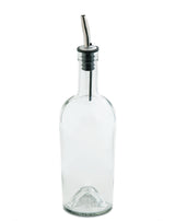 A clear glass olive oil bottle with a stainless steel pourer and black rubber seal. The angled spout features a thin tube extending into the empty bottle, which sits on a white background.