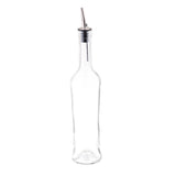 A tall, clear glass bottle with a narrow neck and a stainless steel pourer. The 17 oz bottle is empty and stands upright on a white background, commonly used for dispensing olive oil or vinegar.