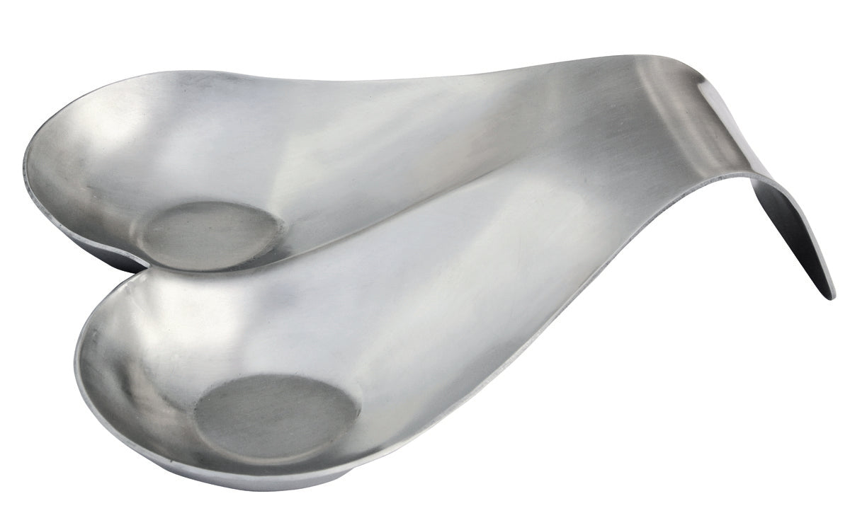 A silver, heart-shaped stainless steel object with two deep indentations, angled upward on one side. The curves suggest it is a medical instrument or possibly a spoon rest, and it appears to be dishwasher safe, resting on a white background.