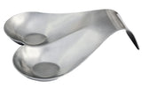 A silver, heart-shaped stainless steel object with two deep indentations, angled upward on one side. The curves suggest it is a medical instrument or possibly a spoon rest, and it appears to be dishwasher safe, resting on a white background.