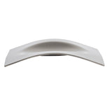 A metallic, slightly curved object with a smooth, matte finish is shown against a white background. Resembling a stainless steel spoon rest, it features a raised center and tapered edges, and is likely dishwasher safe for easy cleaning.