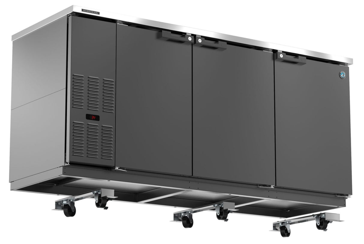 A Hoshizaki stainless steel undercounter refrigerator with three black doors, ventilation panel with digital display, and sturdy caster kit for mobility. This sleek, modern unit is a top choice among commercial back bar models in professional kitchens.