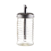 A clear ribbed glass sugar pourer from the Beehive Collection features a stainless steel pour spout and metal lid, perfect for precise pouring; the empty container is photographed on a white background.