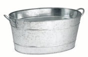 A shiny, oval-shaped TableCraft beverage tub made of galvanized steel with two side handles is shown against a plain white background. The tub features a slightly textured surface and horizontal raised bands for reinforcement.