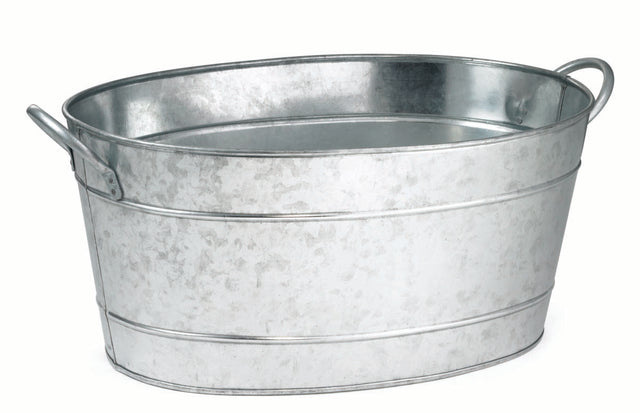 A shiny, oval-shaped TableCraft beverage tub made of galvanized steel with two side handles is shown against a plain white background. The tub features a slightly textured surface and horizontal raised bands for reinforcement.