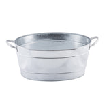 Oval-shaped TableCraft galvanized steel beverage tub with two curved handles on opposite sides. The tub features a shiny, silver finish and two horizontal ridges for added strength, photographed empty against a white background.