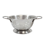A stainless steel mini colander with two side handles and a circular base. The bowl features evenly spaced round holes for draining, and its matte metal surface is empty, photographed on a white background.