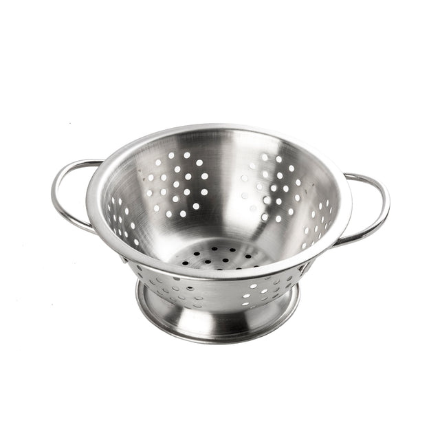 A shiny stainless steel mini colander with two handles, a wide base, and evenly spaced round holes for draining water from food sits on a white background.