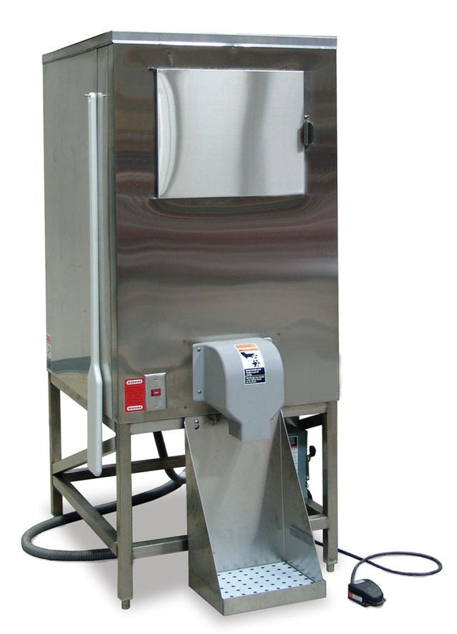 A commercial stainless steel potato peeler machine with a front hatch, mounted on a stand. A chute and collection tray extend from the base, and an ice storage hose is coiled at the back beside the control box and connected foot pedal.