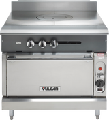 A heavy duty Vulcan V1FT36S commercial range with three control knobs, a solid French top cooking surface, and an oven below. The oven door features a handle and Vulcan logo, with a dial and red indicator light on the front panel.