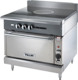 The Vulcan V1FT36S is a heavy duty range with a smooth, solid French top cooking surface, three control knobs, an oven below with a handle, and the Vulcan logo on the oven door. The appliance stands on four short legs.