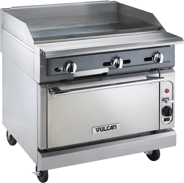 A heavy duty range featuring a 36" griddle, three control knobs, and a gas oven below. The Vulcan brand name appears on the oven door, with a side control panel and temperature dial. Wheels provide mobility for this commercial kitchen essential.