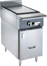 A stainless steel Vulcan V1P18B commercial kitchen griddle features a flat plancha top cooking surface, control knobs, lower storage cabinet, and the Vulcan logo on the front door, all standing on four sturdy legs.