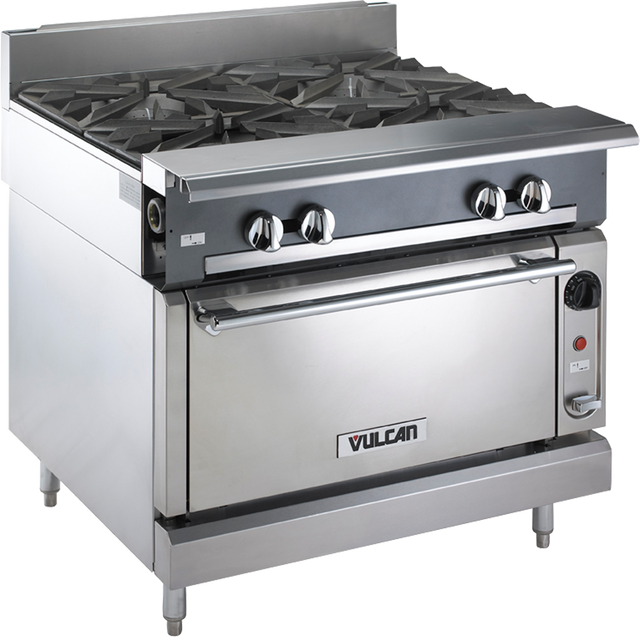 A stainless steel Heavy Duty Range with four large gas burners on top, control knobs on the front panel, a standard oven below with handle, and “Vulcan” branding on the oven door. The appliance stands sturdily on four metal legs.