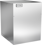 A stainless steel commercial ice maker with a smooth, boxy design and visible “Ice-O-Matic” logo on the upper front panel. Featuring an air-cooled condenser, this machine has a plain, industrial appearance with small screws visible on the front.