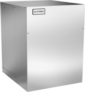 A large, rectangular, stainless steel commercial Quartz Ice® Maker with smooth surfaces and minimal visible controls. The front displays a label reading Ice-O-Matic near the top. This air cooled remote condensed unit features clean lines and a modern, industrial design.