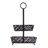 Part of the Farmhouse Collection, this 2-tier fruit basket features ornate geometric cutout patterns in each rectangular black metal basket, stacked on a central pole with a circular handle for easy carrying and four small feet for stability.