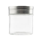 A transparent empty glass jar with a wide opening and a silver metal screw-on lid featuring a rotating top, shown against a plain white background. The cylindrical shaker is clean, dishwasher safe, and the lid has a brushed metallic finish.