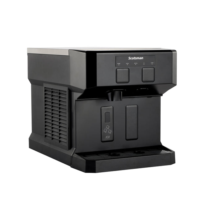A black Scotsman nugget ice machine with a rectangular shape, vented side panel, three icon-labeled buttons on the front, and a dispenser area below. The compact unit offers chewable ice and sits on any flat surface with a matte and glossy finish.