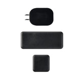 Three black electronics are arranged vertically on a white background: a rectangular wall plug at the top, a long rounded nugget ice dispenser in the middle, and a small square device at the bottom. All objects have a simple, matte finish.