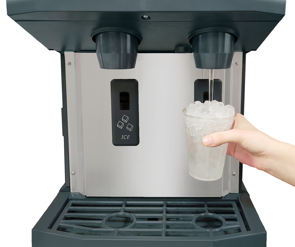 A hand holds a clear plastic cup filled with nugget ice under an ice and water dispenser. Water is being dispensed into the cup. The machine features labeled buttons, touchfree dispensing, and a drip tray at the bottom.