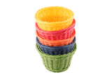 Five woven baskets from the Ridal Collection Basket are stacked inside each other in yellow, pink, orange, blue, and green. These hand-woven polypropylene baskets are pictured from above against a white background.